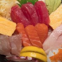 Chirashi · An assortment of sashimi over sushi rice served with miso soup and salad.