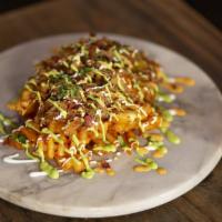Drunken Pig Fries · Waffle fries, covered in melted mixed cheese, beer-braised pulled pork, spicy jalapeño salsa...