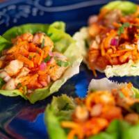 Thai Lettuce Cups · Grilled chicken, Thai sweet chili sauce, wonton strips, red onion, cucumber, carrot, cilantro.
