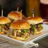 Pulled Pork Sliders (4) · Beer-braised BBQ pulled pork, pickled red onion, garlic aioli and coleslaw on sweet rolls.