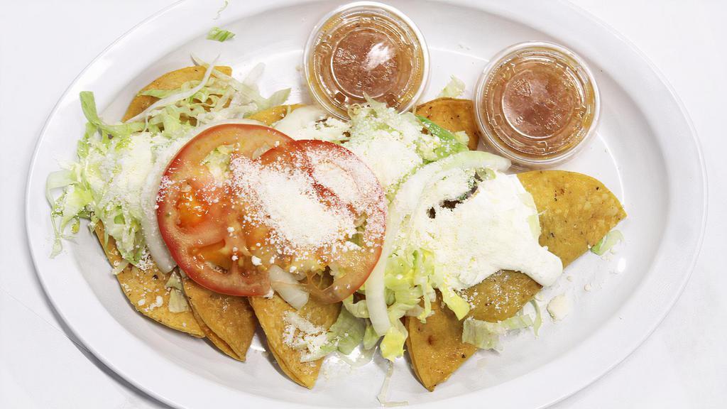 Crispy Tacos · meat, sour cream, lettuce, tomato, onion, cotija cheese, special salsa.