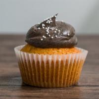 7. Chocolate on Vanilla · Classic fluffy moist vanilla cupcakes topped with a dark rich chocolate frosting.