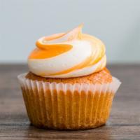 Orange Creamsicle · Soft & fluffy cupcake loaded with orange flavor and topped with an orange swirl buttercream.