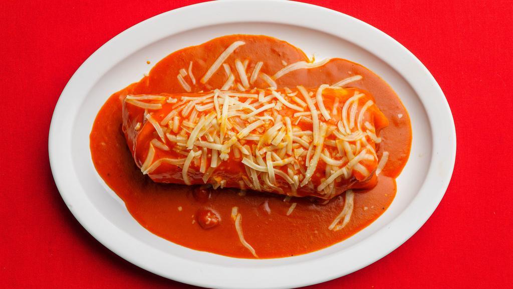 Wet Burrito · Choice of meat with rice,beans,sour cream,guacamole and pico de gallo salsa topped with red sauce and cheese.