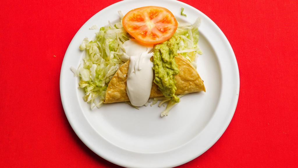 Crispy Taco · crispy corn tortilla with meat, lettuce,cheese, sour cream and guacamole.