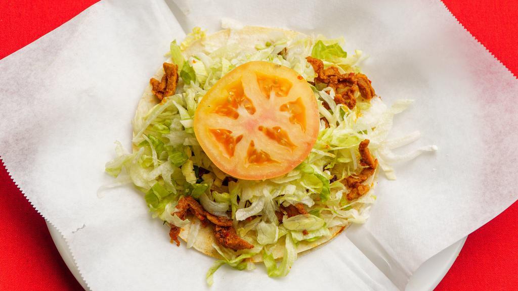 Super Taco · soft corn tortilla with your choice of meat,lettuce,guacamole,cheese,sour cream and salsa.