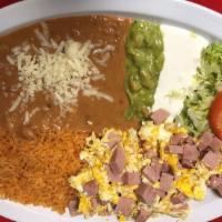 Ham and Eggs · Ham and eggs served with rice, re- fried beans, lettuce, guacamole, cheese, sour cream and c...