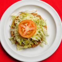 Corn Tostada · Tortilla shell with choice of meat, re-fried beans, lettuce, guacamole,cheese and sour cream.