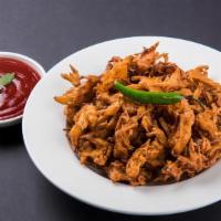 Veg Pakora · Deep-fried Crispy Snack made with Spinach Onions and Carrots.
