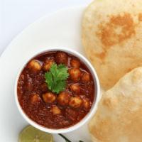 Chana Bhatura (2 Pcs) · Deep-fried Bread served with Chick Peas. *Served with Mint and Sweet Tamarind Sauce.