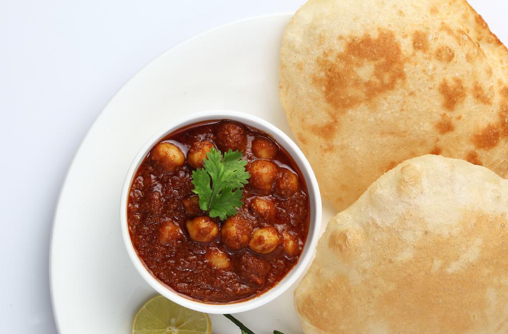 Chana Bathura( 2pcs) · Deep-fried Bread served with Chickpeas Served with Mint and Sweet tamarind Sauce.