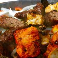 Tandoori Mix Platter · Combination of chicken tikka, shrimp and lamb kebab.