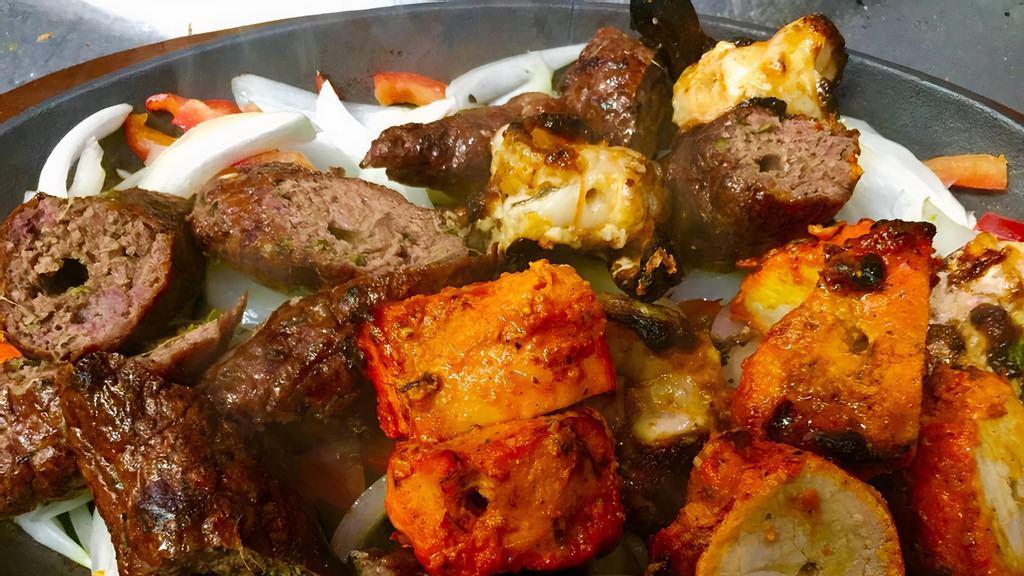 Tandoori Mix Platter · Combination of chicken tikka, shrimp and lamb kebab.