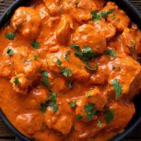 Butter Chicken · Boneless Chicken Pieces cooked with Cream & Tomato Puree with Mild Spices.