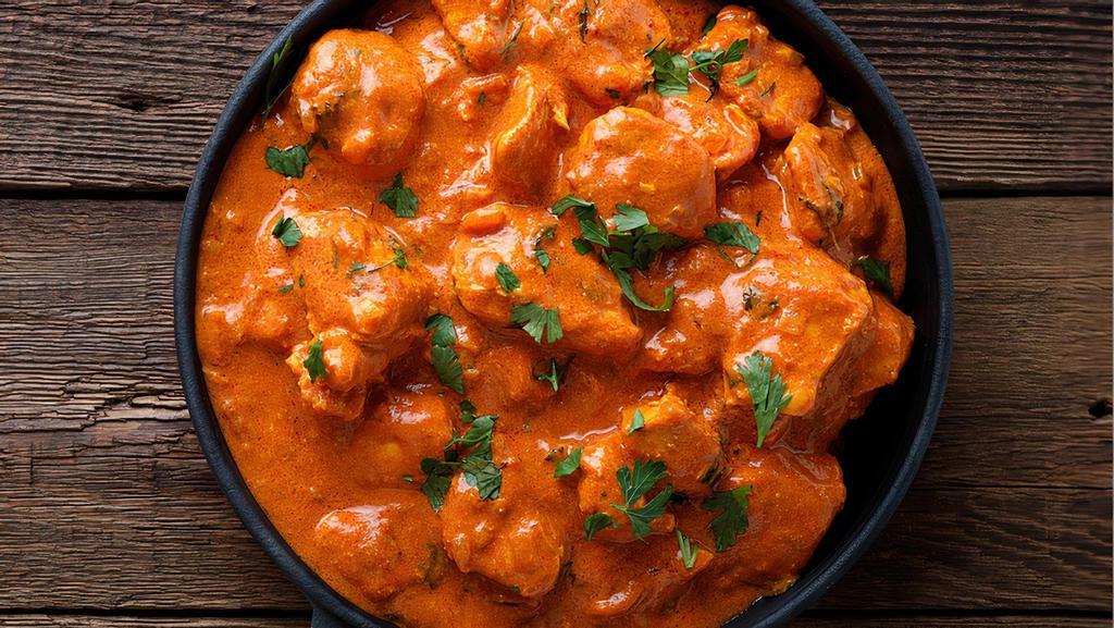 Butter Chicken · Boneless Chicken Pieces cooked with Cream & Tomato Puree with Mild Spices .