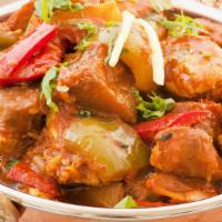 Chicken Vindaloo · Boneless chicken curry cooked with Potato and Vindaloo Masala and Spices.