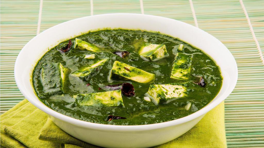 Saag Paneer (Palak) · Cooked with Spinach, Tomato Gravy, Cottage cheese with garlic and spices.