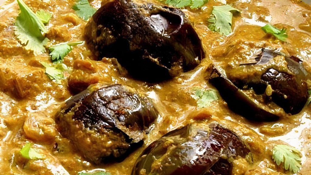Bagara Baingan · Eggplant pieces cooked with peanut sauce, Sesame and coconut with mixed spices.