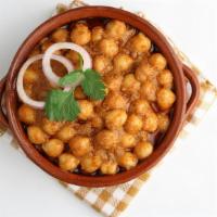 Chana Masala · Chick peas and Tomatoes cooked with fried garlic, ginger, Onions and mixed spices.