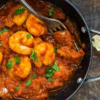 Shrimp Masala · Shrimp cooked in Butter, Tamarind Sauce, Tomato, Onion and Green Bell Pepper.