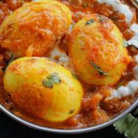 Egg Masala · Boiled eggs cooked with Onion and Tamarind sauce with mixed spices.