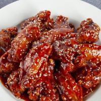A8. Yang Nyoum Chicken · Spicy. Fried chicken wings with homemade sweet and spicy sauce.