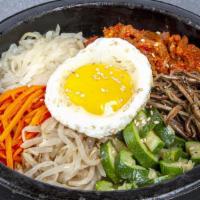 R2. Dol Sot Bi Bim Bab · Rice with a crisped bottom, topped with carrot, zucchini, bean sprouts, fern, radish, egg, a...