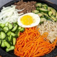 R3. Chul Pan Bi Bim Bab · Rice with crisped bottom, topped with carrot, zucchini,  bean sprouts, cucumber, onion, egg,...