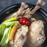 S4. Han Bang Dak Gom Tang · Nutritious chicken soup with two leg quarters, glass noodles, jujube, and ginseng.