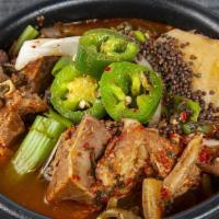S10. Gam Ja Tang · Spicy. Spicy soup with pork spine, potato, vegetables, and ground wild sesame seeds.