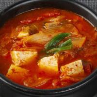 S7. Kim Chi Ji Gae · Spicy kimchi stew with pork, vegetables, and tofu.