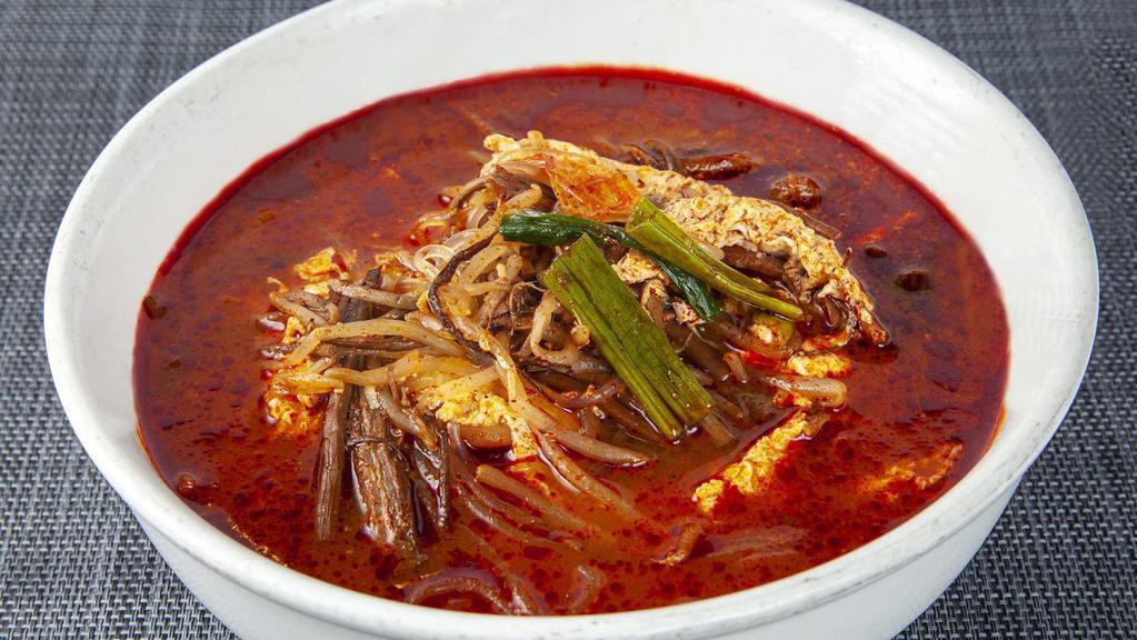 S1. Yook Gae Jang · Spicy beef soup with glass noodle, egg, and vegetables.