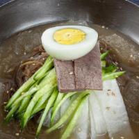 N1. Mool Naeng Myoun · Cold noodle in meat broth with sliced beef, cucumber, radish, and egg.