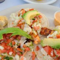 Fish Tacos (3) · Soft tortillas with fresh grilled fish & coleslaw.