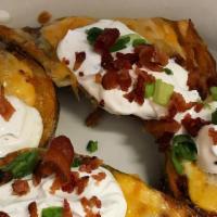Potato Skins · Topped with burnt end brisket, cheese, sour cream.