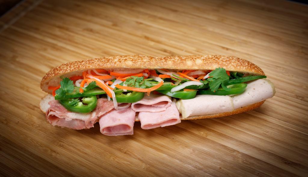 1). Combination · Steamed pork-roll, ham, headcheese, pate, house mayo, pickled veggie, white onion, cucumber, Jalapeño, cilantro, soy sauce.