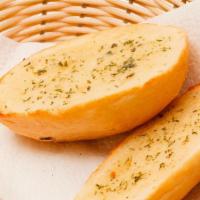 Pesto Garlic Bread · Toasted bread topped with garlic pesto, and mozzarella cheese.
