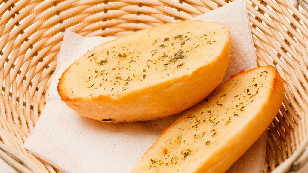 Pesto Garlic Bread · Toasted bread topped with garlic pesto, and mozzarella cheese.