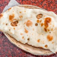 Plain Naan · Bread baked in a clay oven.