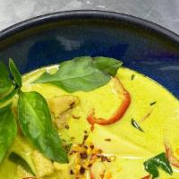 Green Thai Curry · Creamy and aromatic green Thai curry prepared with, bamboo shoots, peppers, and Chicken. Con...