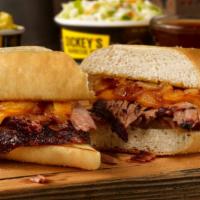 Pit Dip Sandwich Plate · Brisket, pit-smoked caramelized onions and cheddar on a toasted hoagie. Served with smoky be...