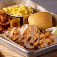 Marinated Chicken Plate · Sliced marinated chicken breast, served with 2 sides and a roll.