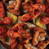 Wings · Choice of sauce and served with pickles.