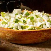 Cabbage Slaw · Finely diced cabbage and carrots, seasoned with a tangy and sweet coleslaw dressing.