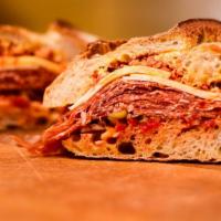 The Calabrian · Hot salami with Provolone cheese, Dijon, red onions, pepperoncini, mild Italian peppers, oil...
