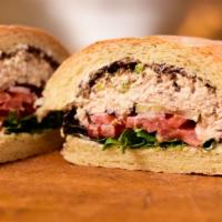 The Classic Albacore Tuna Salad · With mayo, mixed greens, tomato and olive tapenade on soft sourdough roll