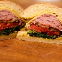 The Classic Baked Ham And Swiss · With mayo, yellow mustard, mixed greens, tomatoes, pickles, onions and mild Italian peppers ...
