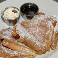 Cinnamon Cinnamon French Toast Special · Served with 2 eggs and choice of two link sausage or bacon.