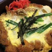 Katsu Don · Deep fried pork or chicken cutlet, and egg over rice .