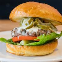 TNT Burger
 · With jalapenos and pepper jack cheese. Served with lettuce, tomatoes, house made garlic, and...